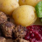 Homemade gluten-free Swedish Meatballs served with lingonberry jam, potatoes and salad.